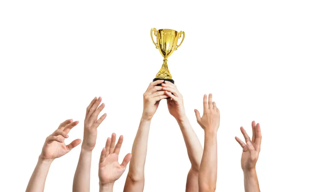 Sports Trophies Online. Winner is holding trophy in hands. Isolated on white background. Expert Engraving, 