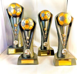 Set of football trophies on base with 3 stars on column
