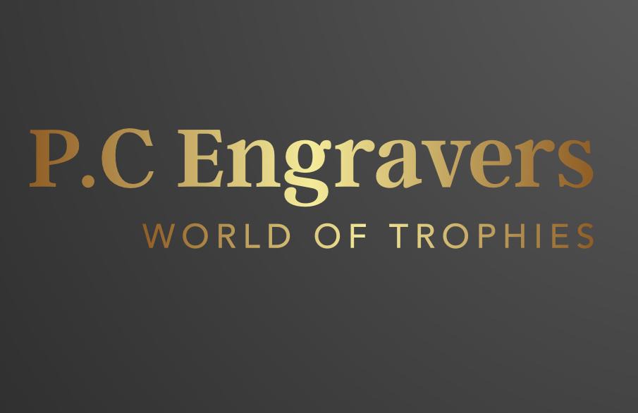 P.C. Engravers  - The Best Trophy engravers in Dorset - Golden logo on dark Back round